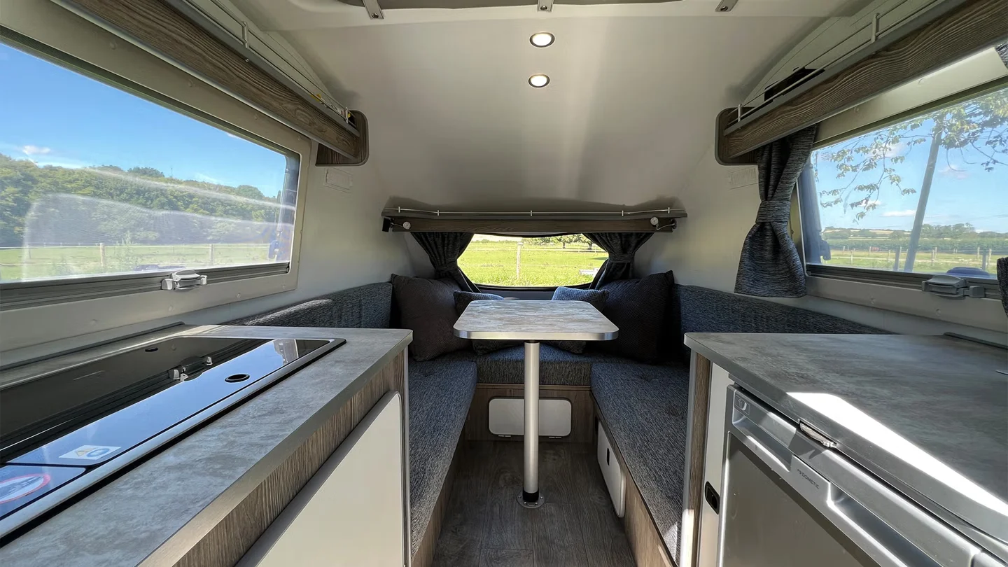 Go-Pod interior with seating, kitchen and storage