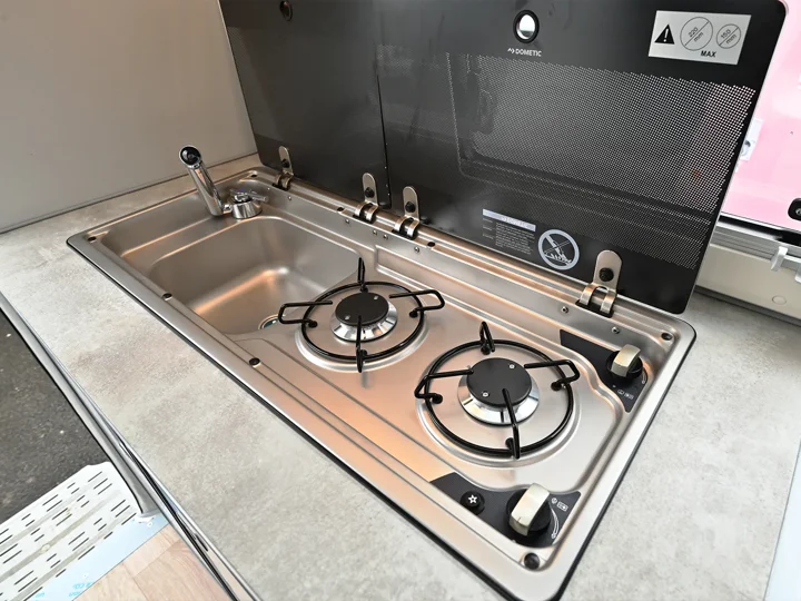 Stainless steel sink and two-burner hob