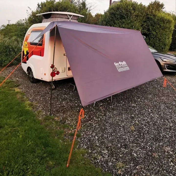 A Go-Pod set up with a purple camping canopy