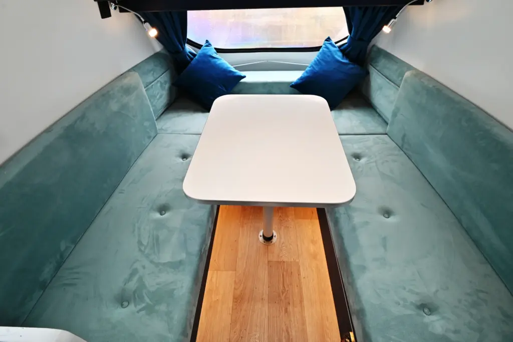 Blue-green lounge upholstery with the table set up