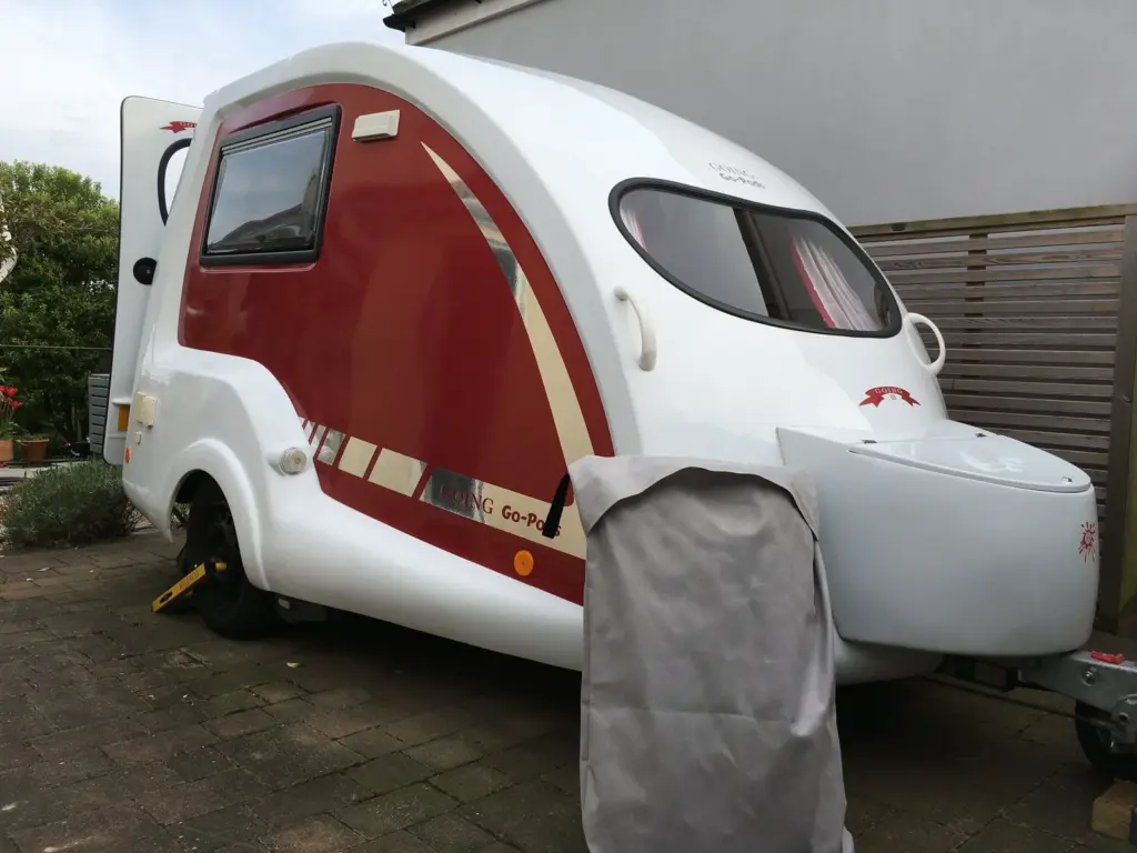Red and white Go-Pod parked on a paved driveway