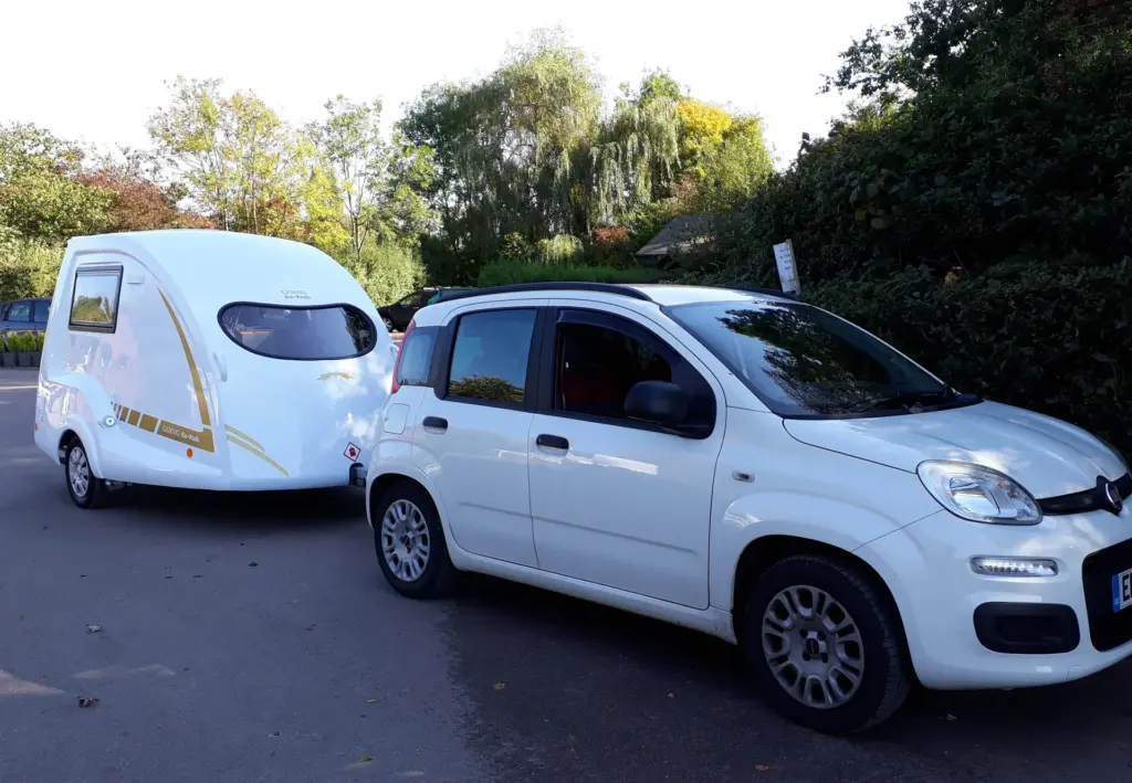 White Fiat Panda with a Go-Pod attached