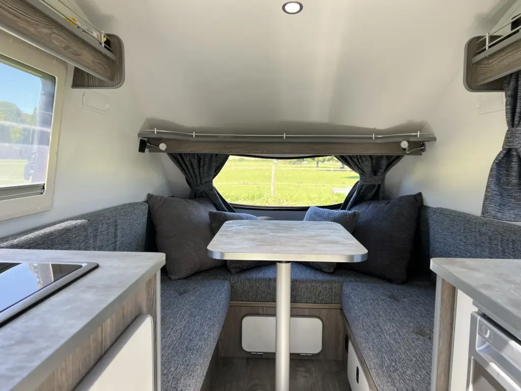 Go-Pod seating area with a table between the benches
