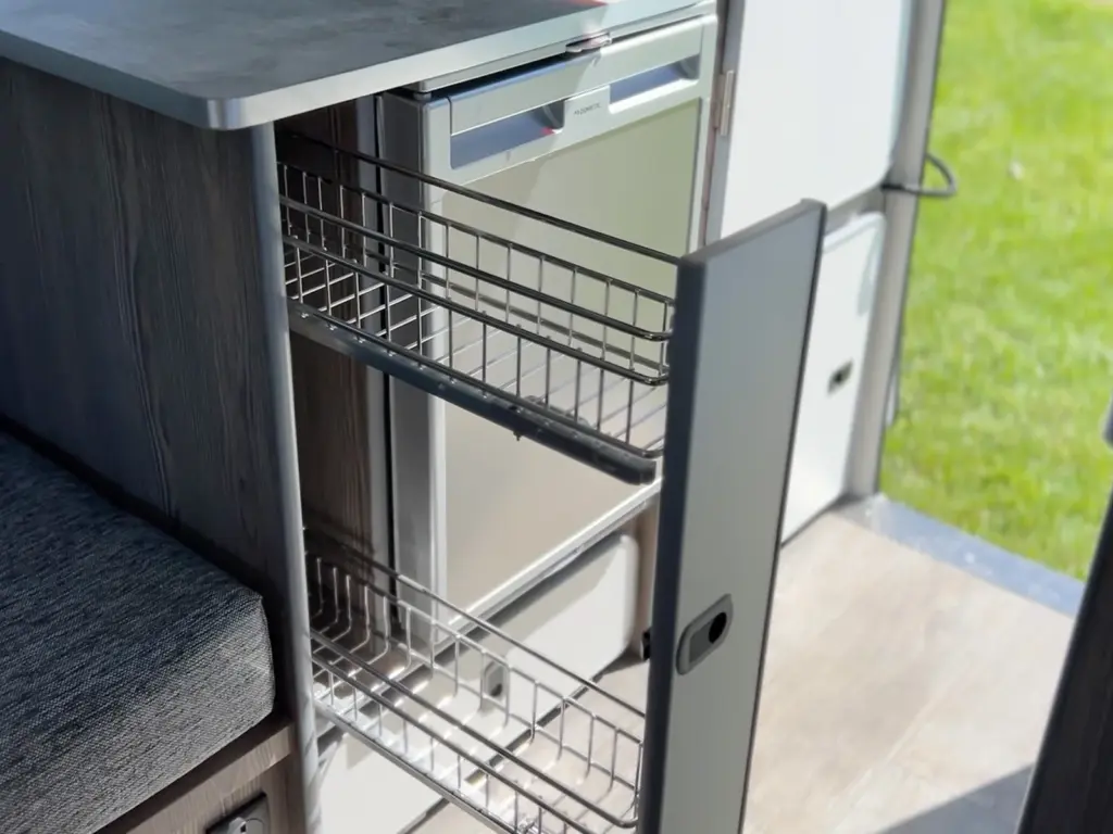 Pull-out wire pantry rack beside the seating