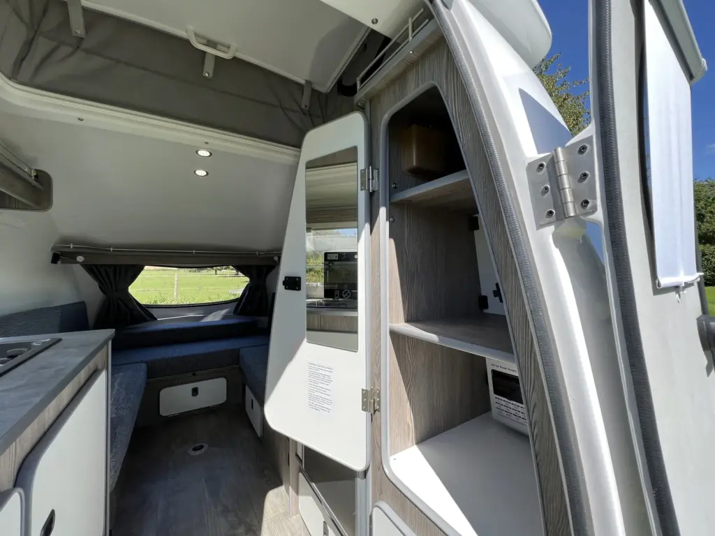 Open wardrobe and shelving beside the Go-Pod entrance